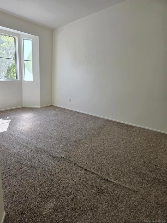 unfurnished room with carpet floors