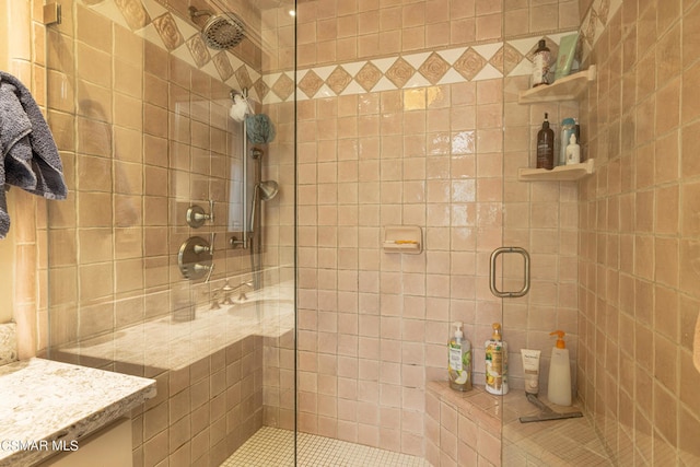 bathroom with vanity and walk in shower