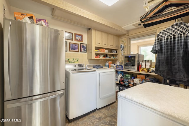 clothes washing area with separate washer and dryer