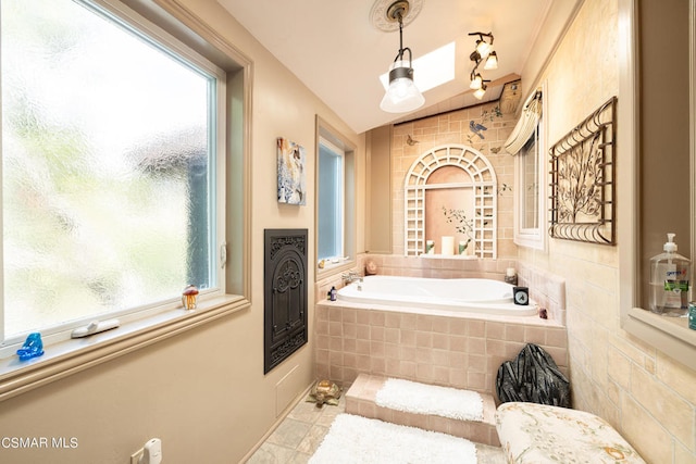 bathroom featuring tiled bath