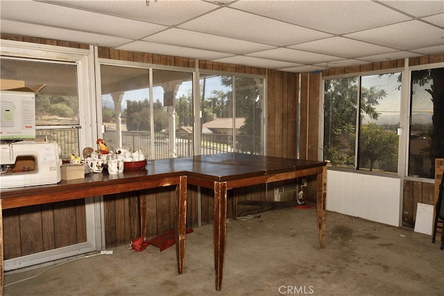 sunroom / solarium with a drop ceiling and bar area