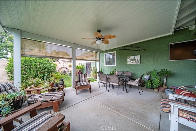 sunroom / solarium featuring ceiling fan