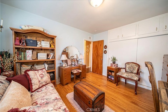 home office with light hardwood / wood-style flooring