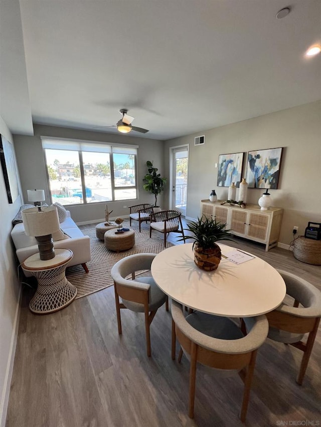 dining space featuring ceiling fan and hardwood / wood-style flooring