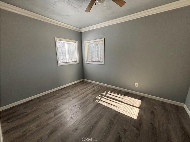 empty room with ceiling fan, dark hardwood / wood-style floors, and crown molding