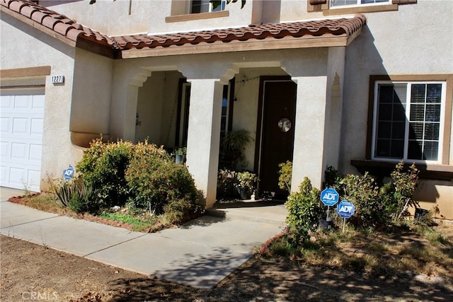 doorway to property featuring a garage