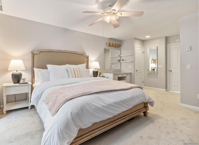 bedroom with ceiling fan, a closet, and light carpet