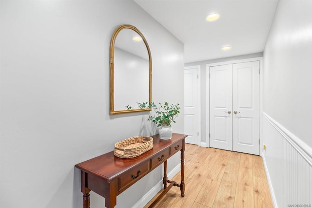 corridor featuring light hardwood / wood-style floors