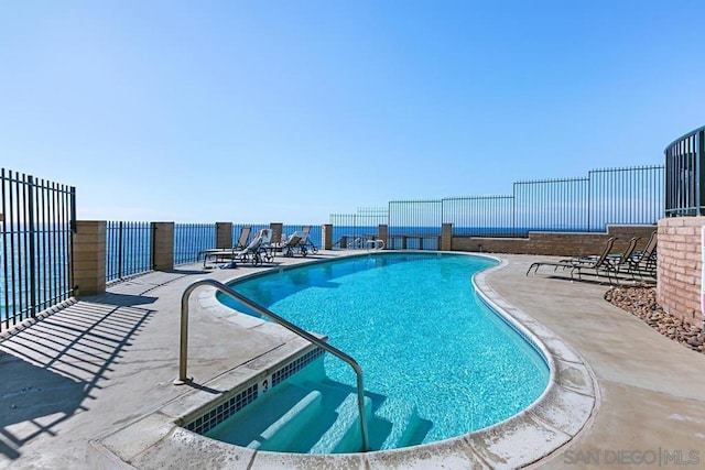 view of swimming pool featuring a patio