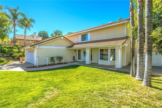 view of front facade featuring a front yard and a garage