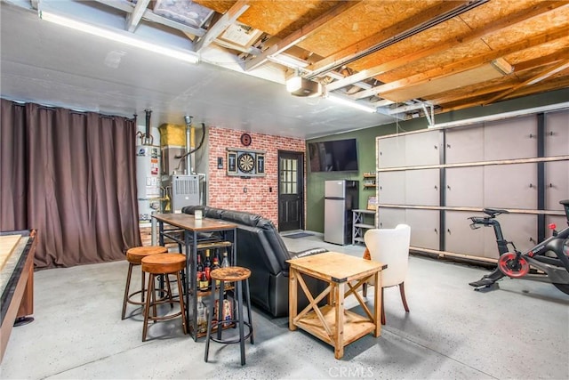 garage with gas water heater, a garage door opener, and fridge