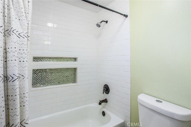 bathroom featuring toilet and shower / bath combo with shower curtain