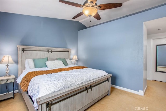 bedroom featuring ceiling fan, light colored carpet, and vaulted ceiling