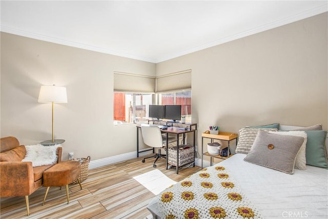 bedroom with hardwood / wood-style flooring and ornamental molding