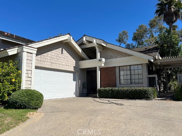 ranch-style home featuring a garage