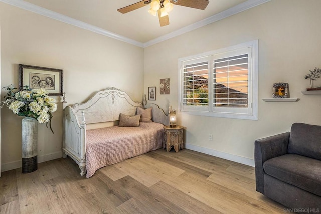 bedroom with light hardwood / wood-style floors, ceiling fan, and crown molding