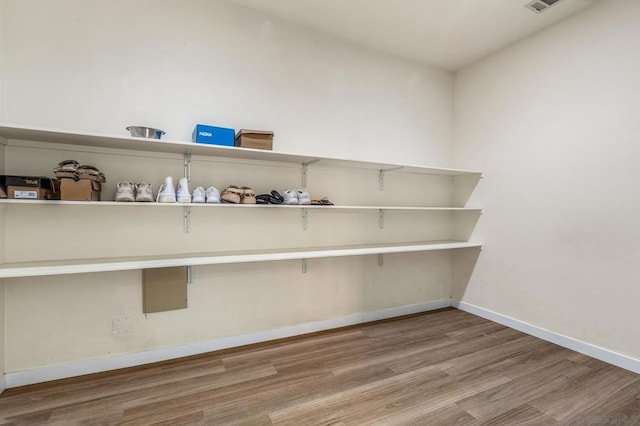 laundry room featuring hardwood / wood-style floors