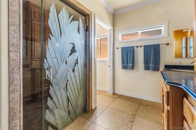 bathroom with tile patterned flooring, vanity, ornamental molding, and a shower with door