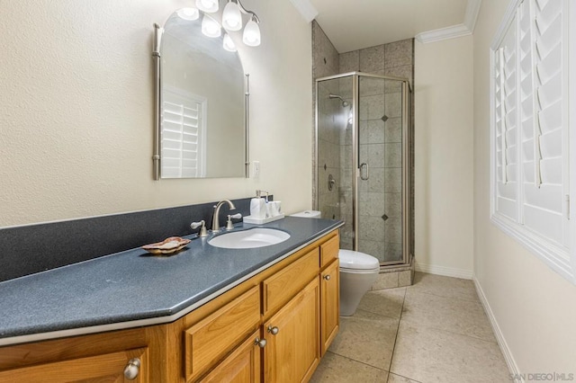 bathroom featuring walk in shower, tile patterned flooring, crown molding, toilet, and vanity