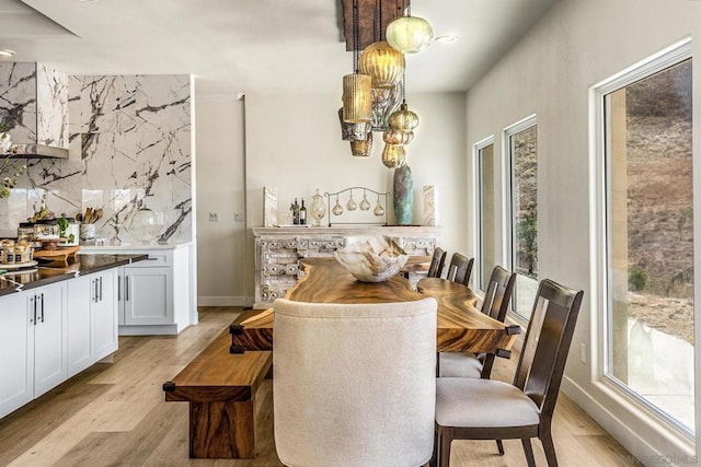 dining area featuring light wood-type flooring