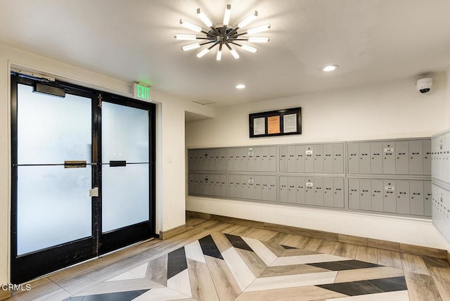 interior space featuring light wood-type flooring and a mail area