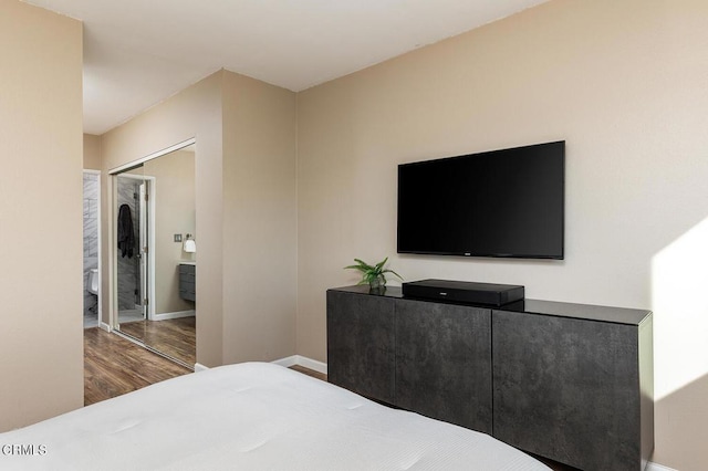 bedroom with hardwood / wood-style flooring and a closet