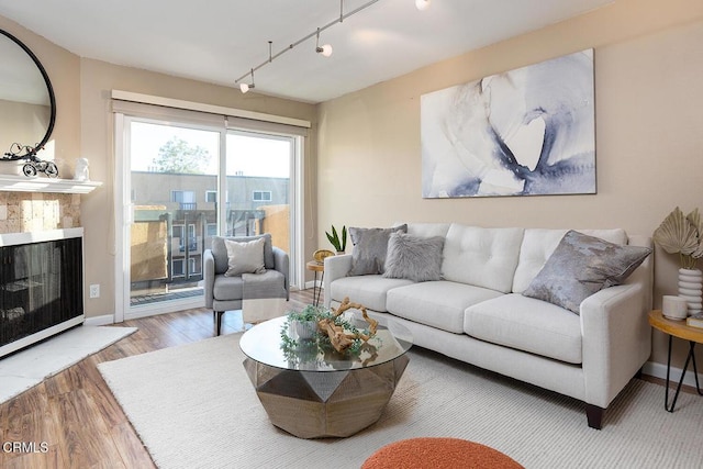 living room featuring hardwood / wood-style floors and rail lighting