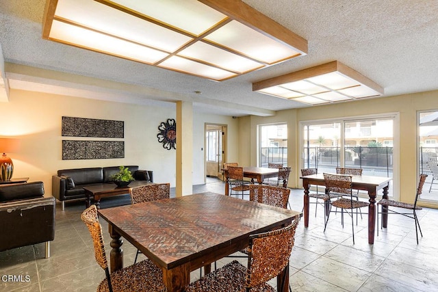 dining area with a textured ceiling