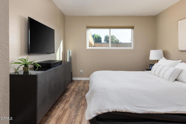 bedroom featuring dark hardwood / wood-style floors