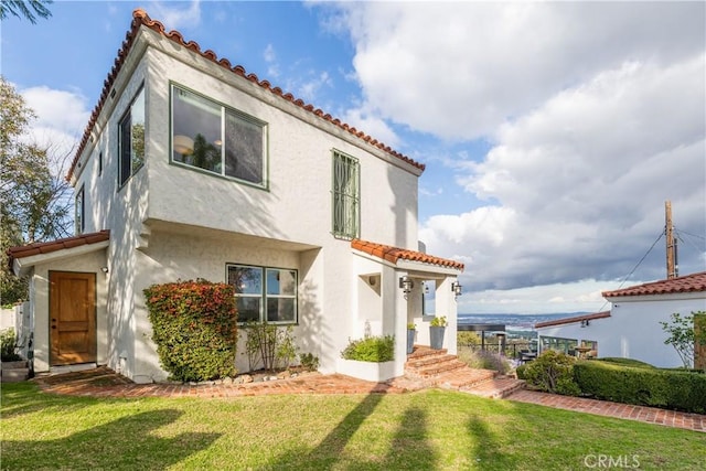 6401 Corsini Pl, Rancho Palos Verdes, CA 90275 - view of front of property featuring stucco siding, a front lawn, and a tiled roof