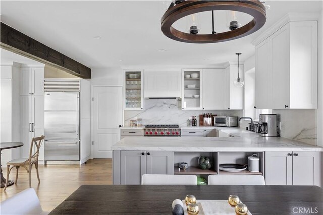 6401 Corsini Pl, Rancho Palos Verdes, CA 90275 - kitchen with built in fridge, white cabinetry, tasteful backsplash, light wood-style flooring, and open shelves
