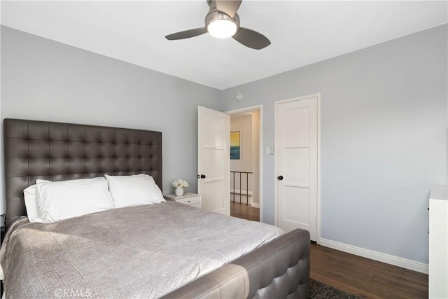 bedroom featuring wood finished floors, baseboards, and ceiling fan