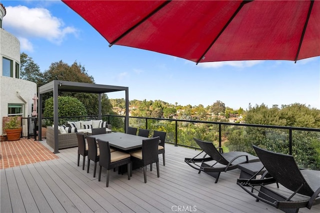 wooden deck featuring an outdoor living space and outdoor dining area