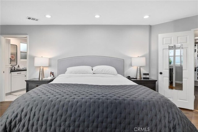 6401 Corsini Pl, Rancho Palos Verdes, CA 90275 - bedroom with wood finished floors, recessed lighting, and ensuite bath