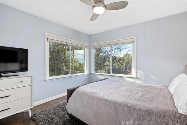6401 Corsini Pl, Rancho Palos Verdes, CA 90275 - bedroom featuring wood finished floors, multiple windows, baseboards, and ceiling fan
