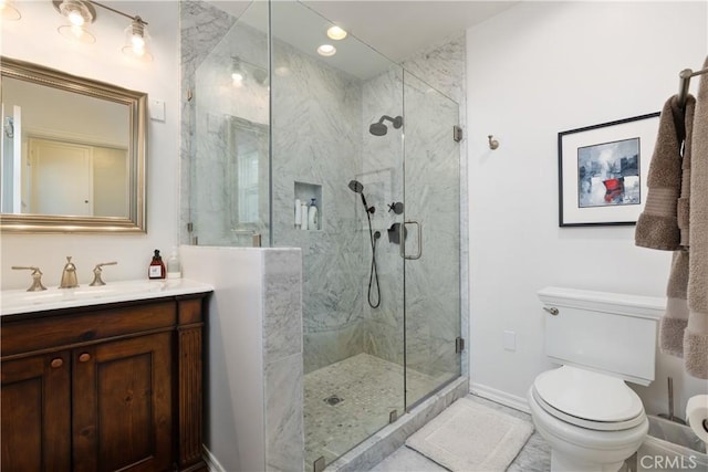 6401 Corsini Pl, Rancho Palos Verdes, CA 90275 - bathroom with a marble finish shower, baseboards, vanity, and toilet