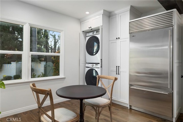 6401 Corsini Pl, Rancho Palos Verdes, CA 90275 - interior space featuring recessed lighting, stainless steel built in refrigerator, dark wood finished floors, white cabinetry, and stacked washer and clothes dryer