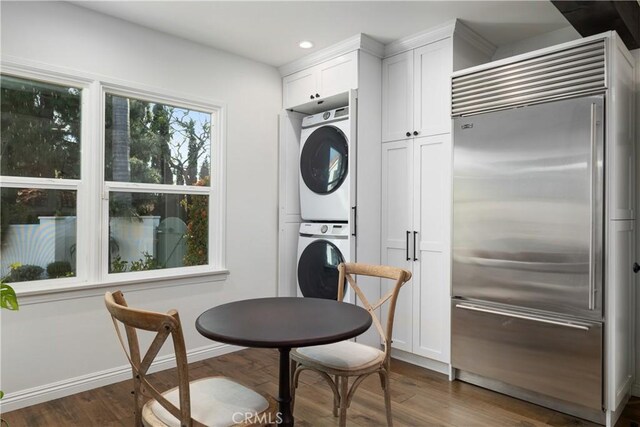 6401 Corsini Pl, Rancho Palos Verdes, CA 90275 - kitchen featuring stainless steel built in refrigerator, estacked washer and dryer, dark wood finished floors, white cabinetry, and recessed lighting