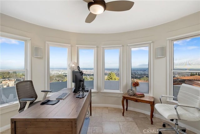 home office featuring ceiling fan and a wealth of natural light