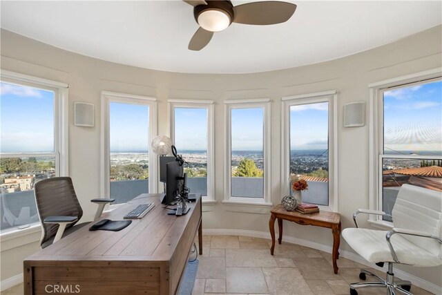 6401 Corsini Pl, Rancho Palos Verdes, CA 90275 - office featuring baseboards, stone tile flooring, and ceiling fan
