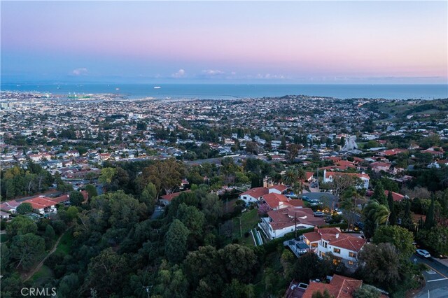 aerial view at dusk with a water view