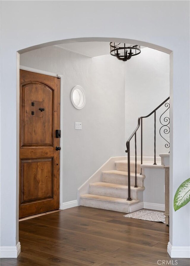 entrance foyer with dark hardwood / wood-style floors