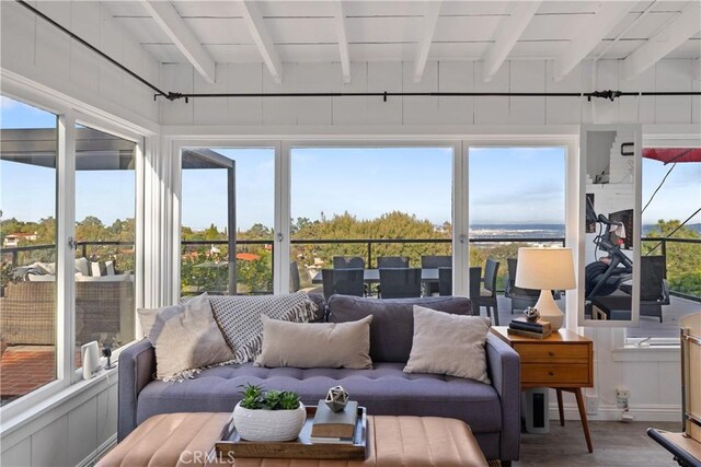 sunroom / solarium with beamed ceiling