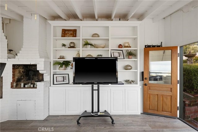 living room with beamed ceiling and light hardwood / wood-style flooring