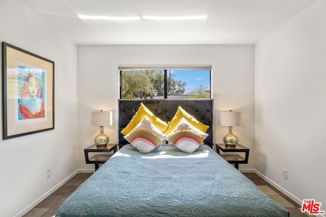 bedroom featuring dark wood-type flooring