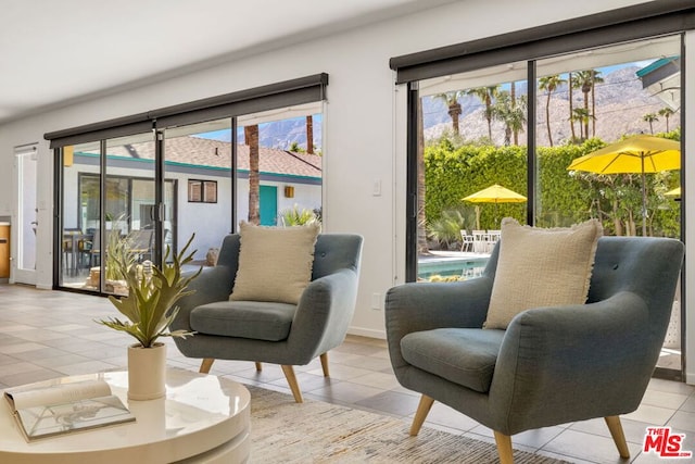 interior space with plenty of natural light and light tile patterned flooring