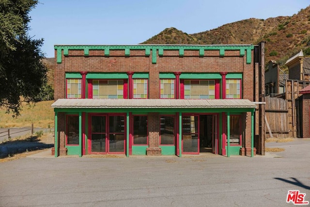 view of building exterior with a mountain view