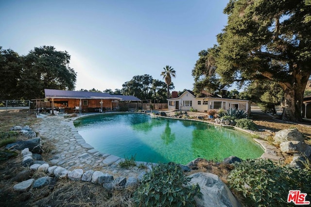 view of swimming pool featuring a patio