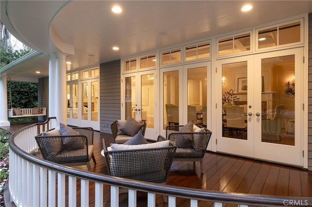 deck featuring french doors and an outdoor living space