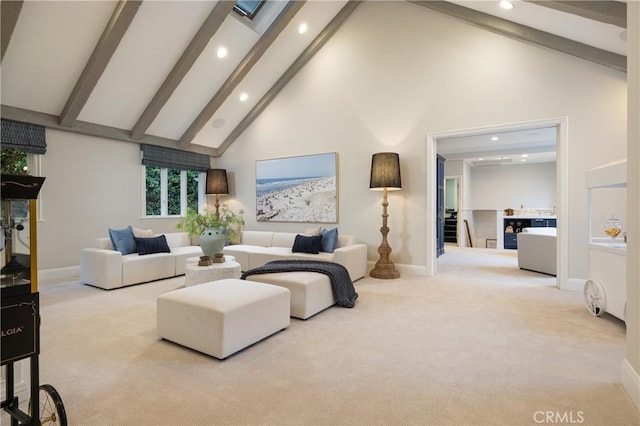 living room featuring beam ceiling, light carpet, and high vaulted ceiling